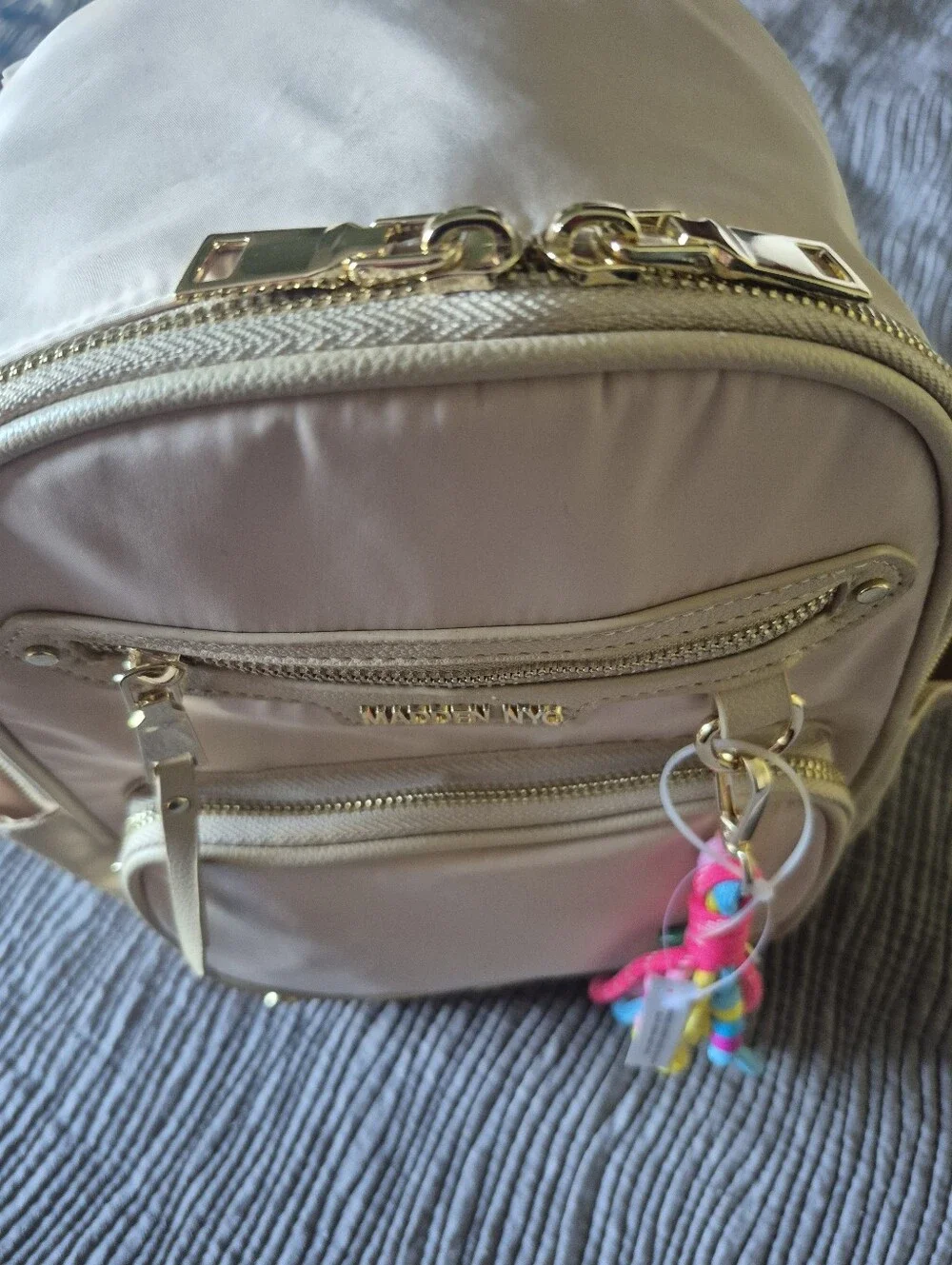 Madden NYC Kids Beige Mini Backpack with Colorful Tassel Charm
